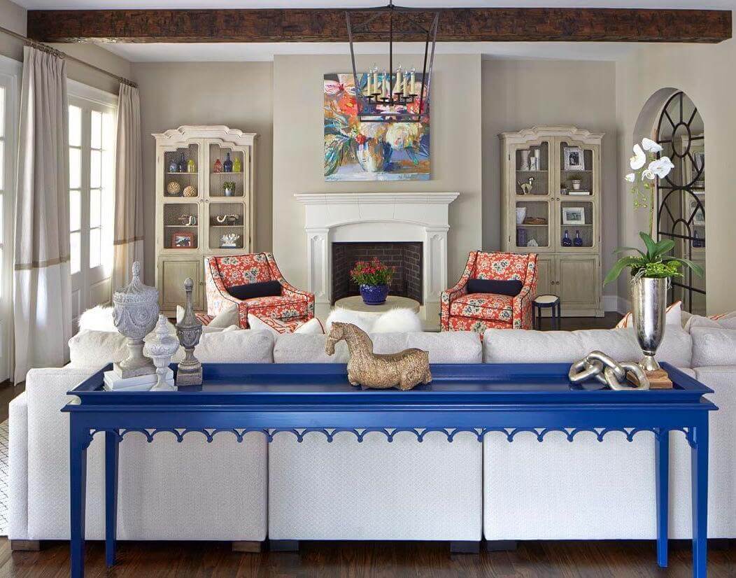 An extra-long Bernhardt.com sectional and a custom lacquered sofa table (96” long) show that big-scale furniture can be chic, too.