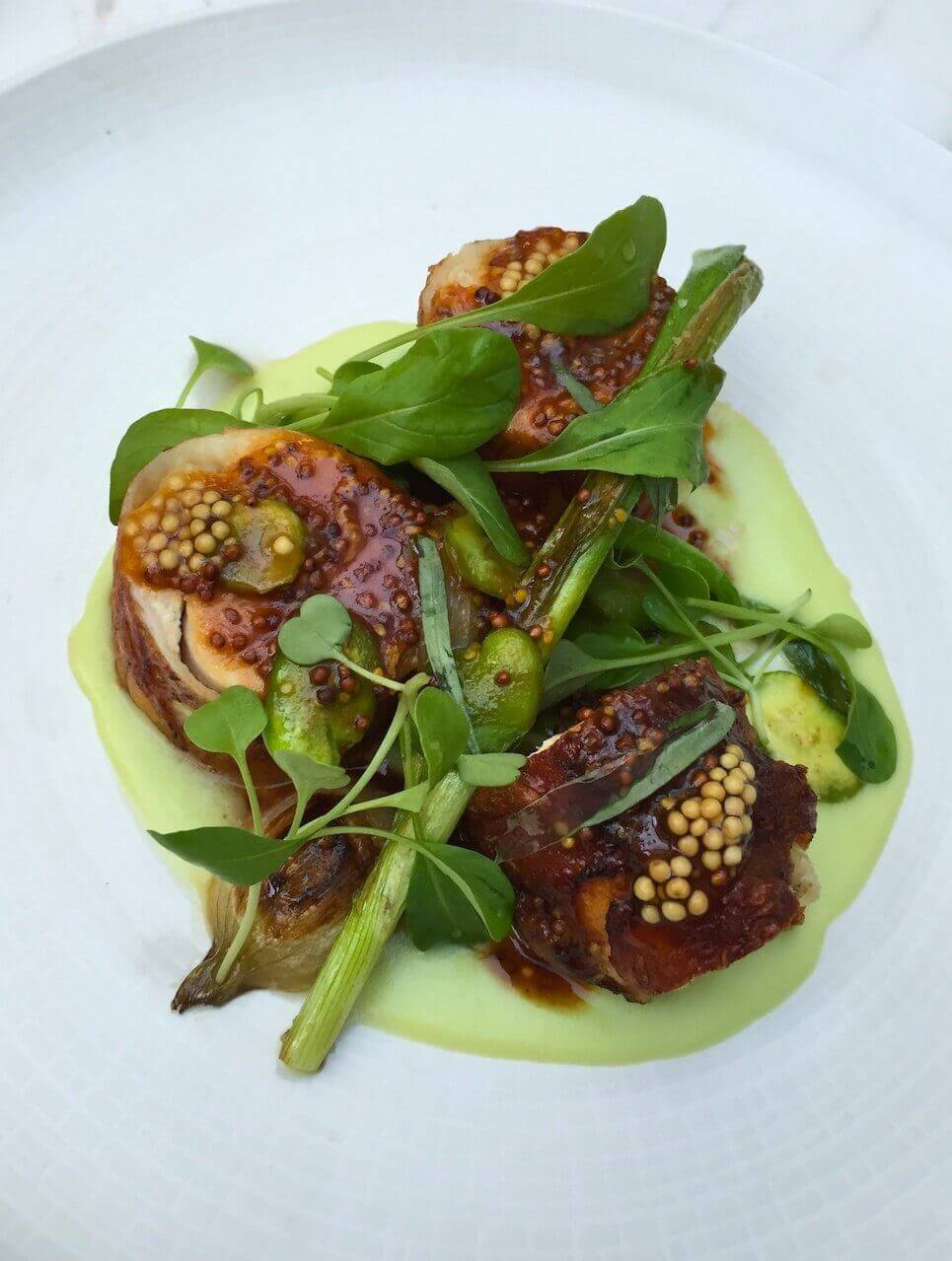 The roasted chicken at Impero Caffe in Chelsea (imperorestaurants.com) is flavored by spring onion, fava beans and mustard seed jus.