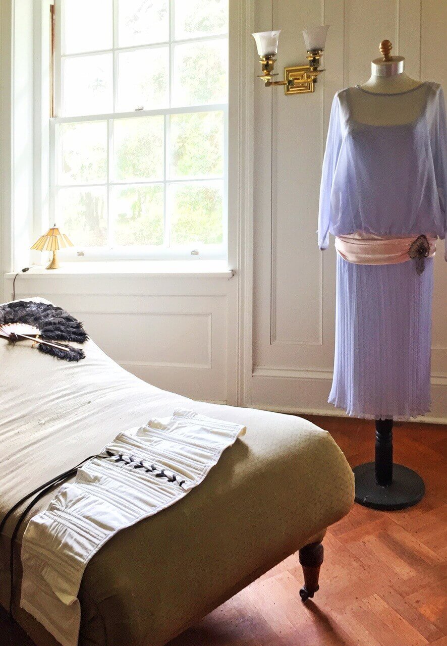Did you know that fainting couches get their name from women becoming light-headed after removing their corsets, so they often had to lie down? A bedroom in Plum Orchard features fashions from times gone by, as well as a vintage fainting couch.