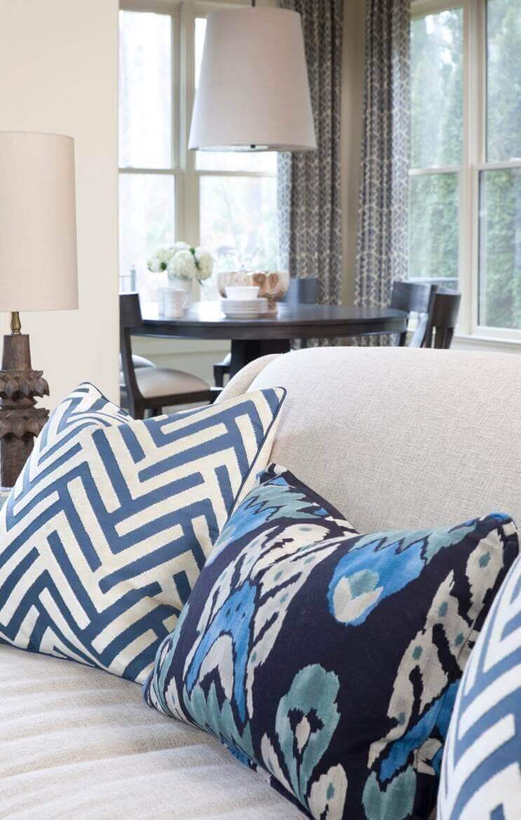 Delegating patterns to easy-to-replace accessories such as pillows allows more opportunities to change the look.