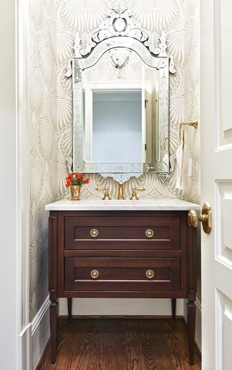 Farrow and Ball wallpaper livens up the powder room.
