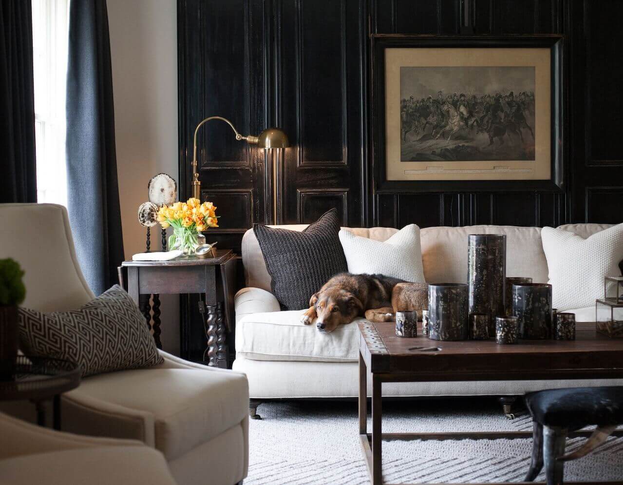 In Sean's own house, he added dark antique doors against a white wall for depth.