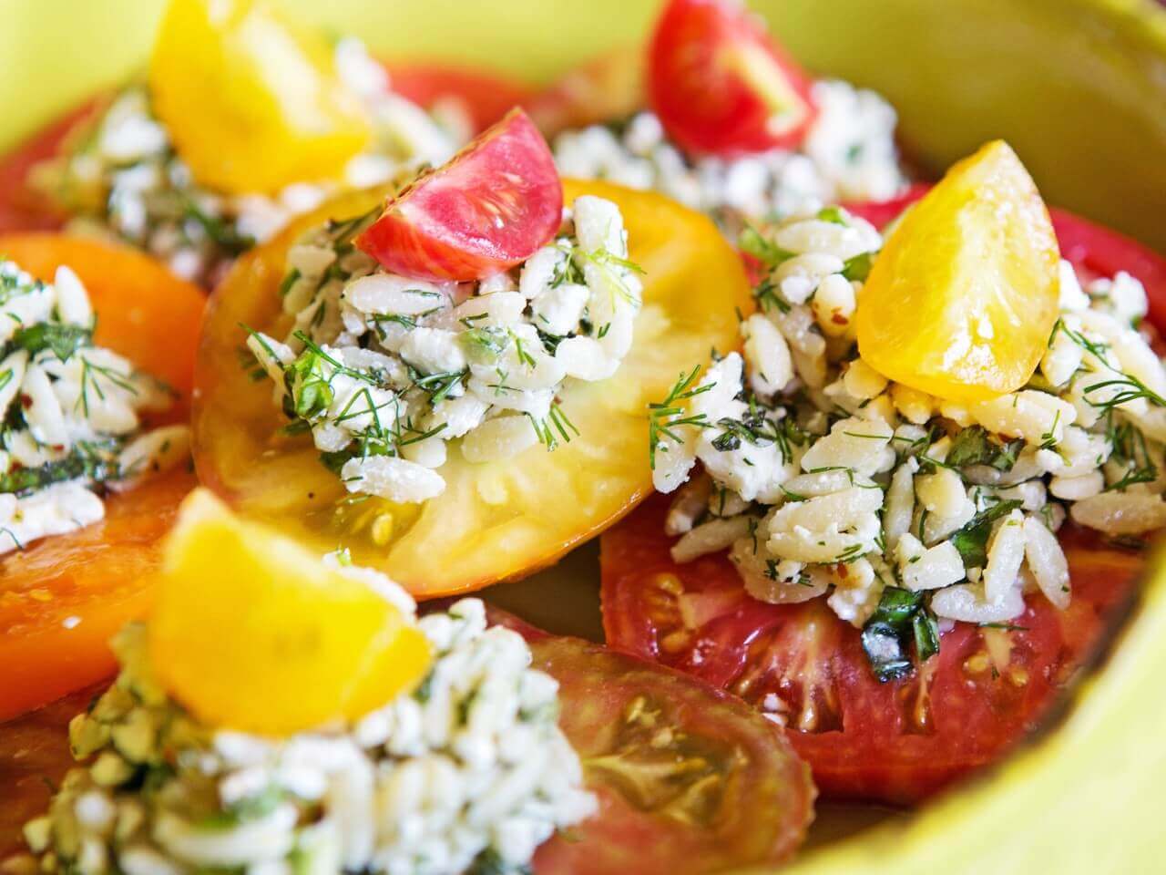 Finish each orzo salad-topped tomato with an alternating colored cherry tomato for a truly eye-catching dish!