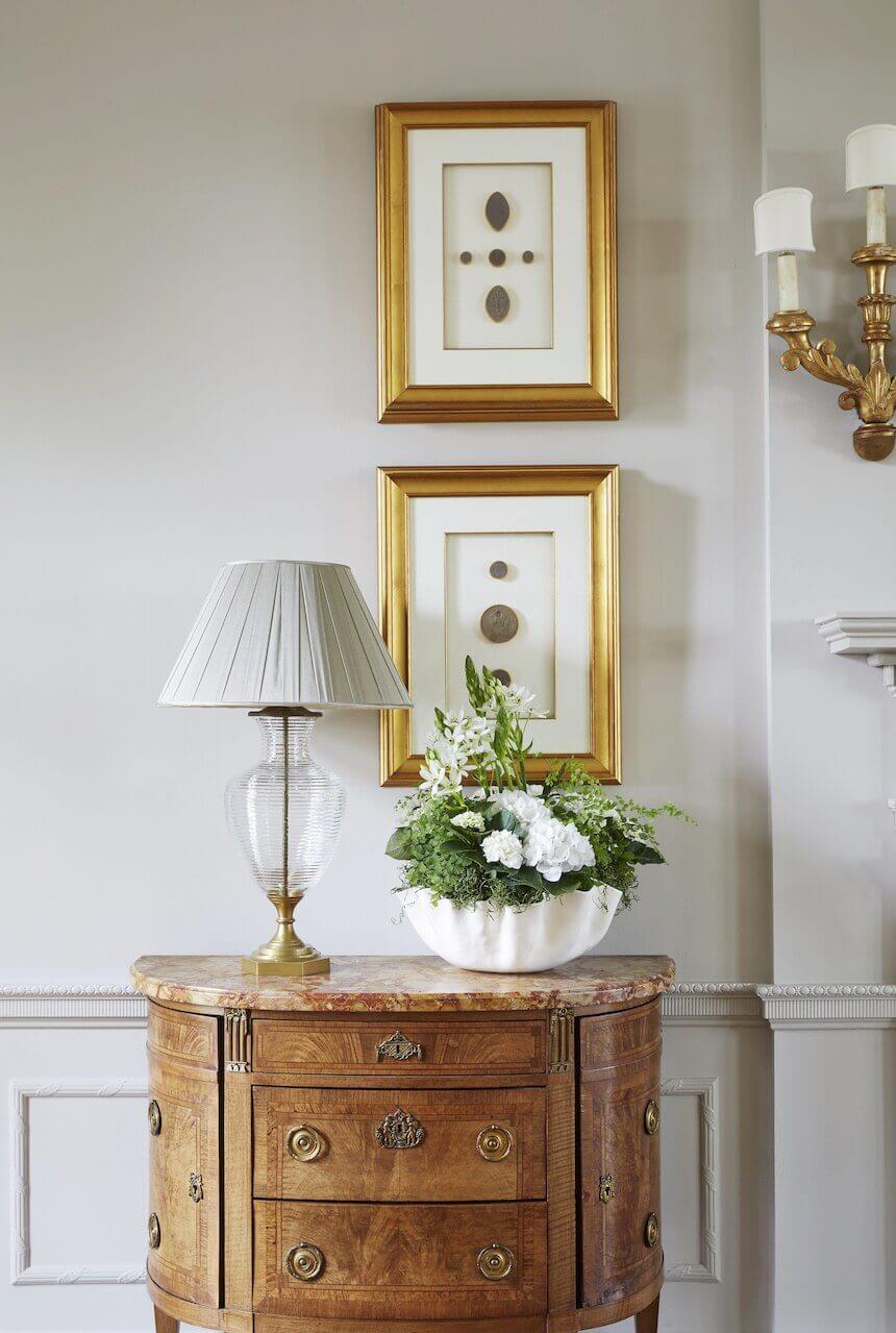 These antique intaglios are displayed in gilded frames. The clear etched crystal lamp was handmade in England and is topped with a beautiful silk chiffon shade in a warm taupe. These antique intaglios are displayed in gilded frames. The clear etched crystal lamp was handmade in England and is topped with a beautiful silk chiffon shade in a warm taupe.