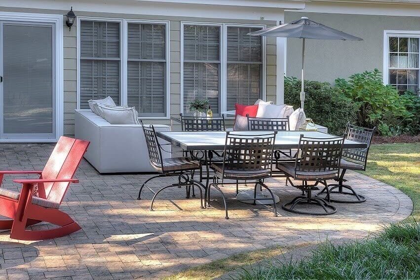 Lots of seating is an important part of outdoor entertaining A patio table, outdoor couch and rocking chairs offer a ton of needed seating.