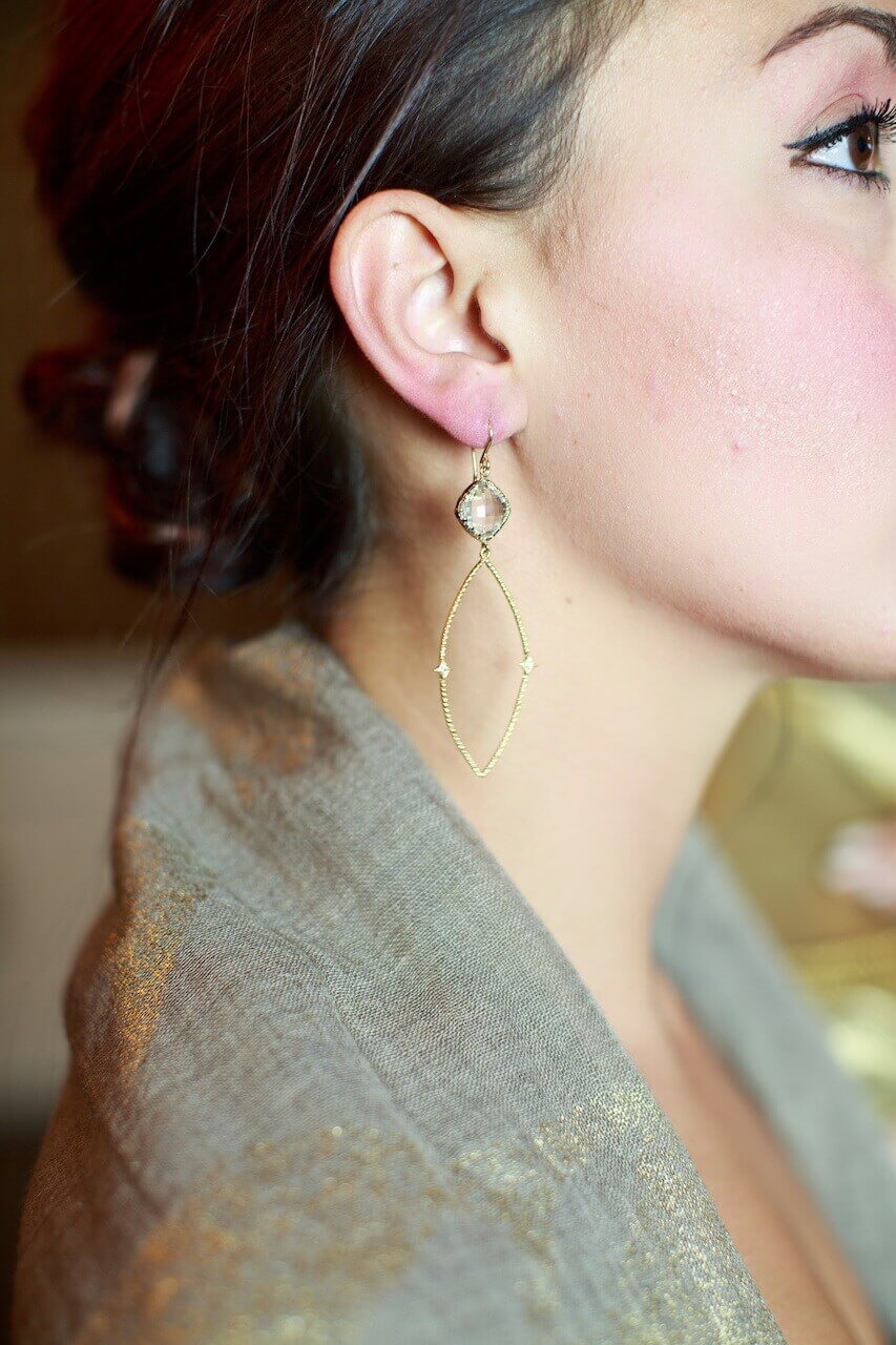 Understated elegance: Tolani taupe/gold wrap, $109 and Kim Gambrell earrings, $79, from Betty Hays. Understated elegance: Tolani taupe/gold wrap, $109 and Kim Gambrell earrings, $79, from Betty Hays.