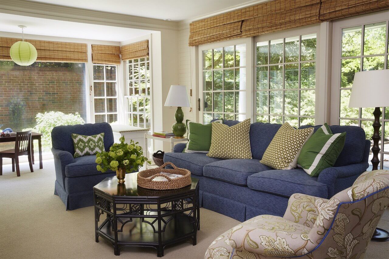 “This family room is where everyone hangs out to watch TV,” says the designer,  “So it needed to be comfortable and durable.  I love navy blue upholstery as a durable alternative to beige and grey.  These Charles Stewart sofas are upholstered in Duralee fabric with Schumacher throw pillows.”