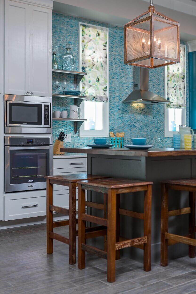 The wood-topped island warms up the modern kitchen. The wood-topped island warms up the modern kitchen.