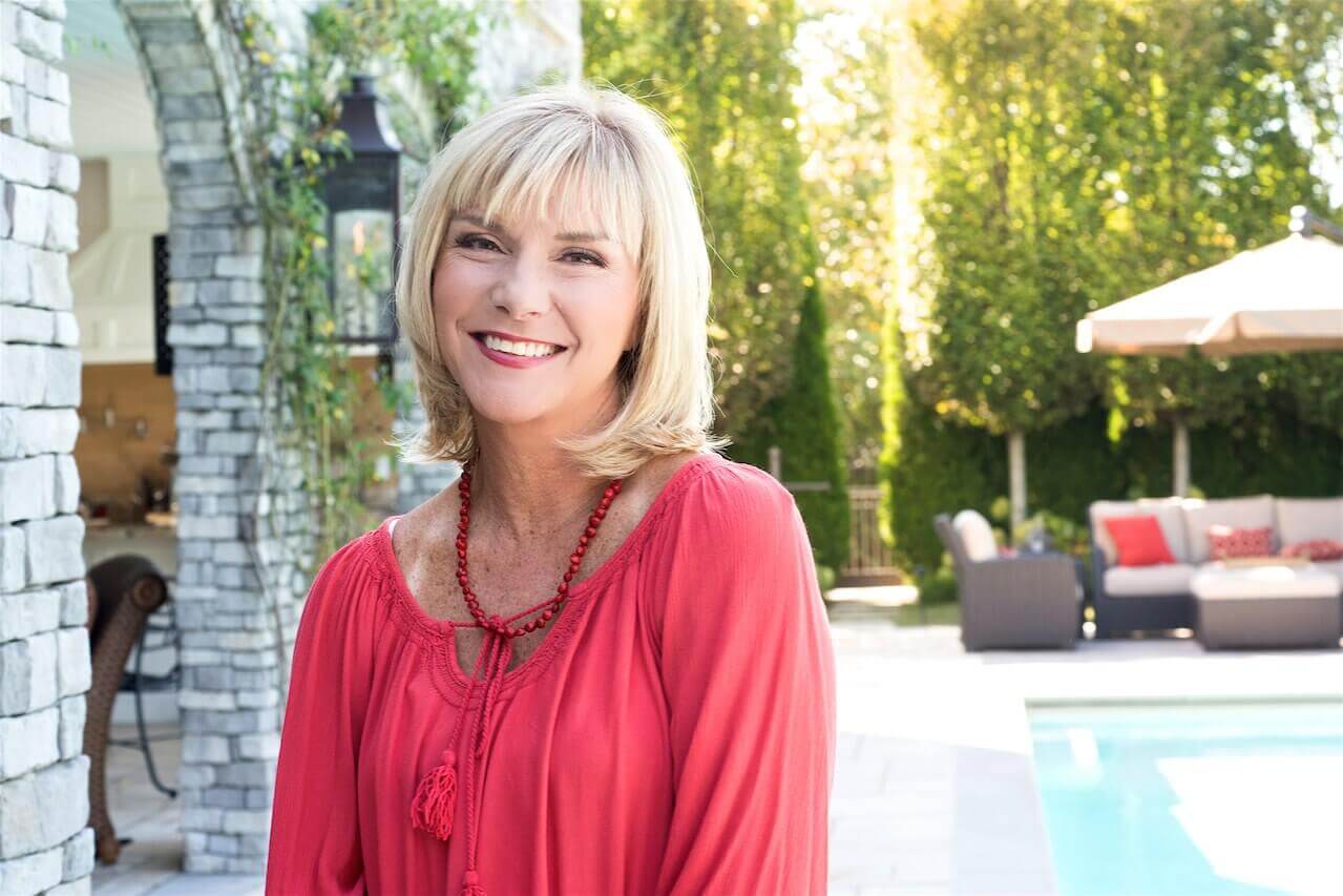 One way in which Beth enjoys recharging is entertaining poolside at her home.