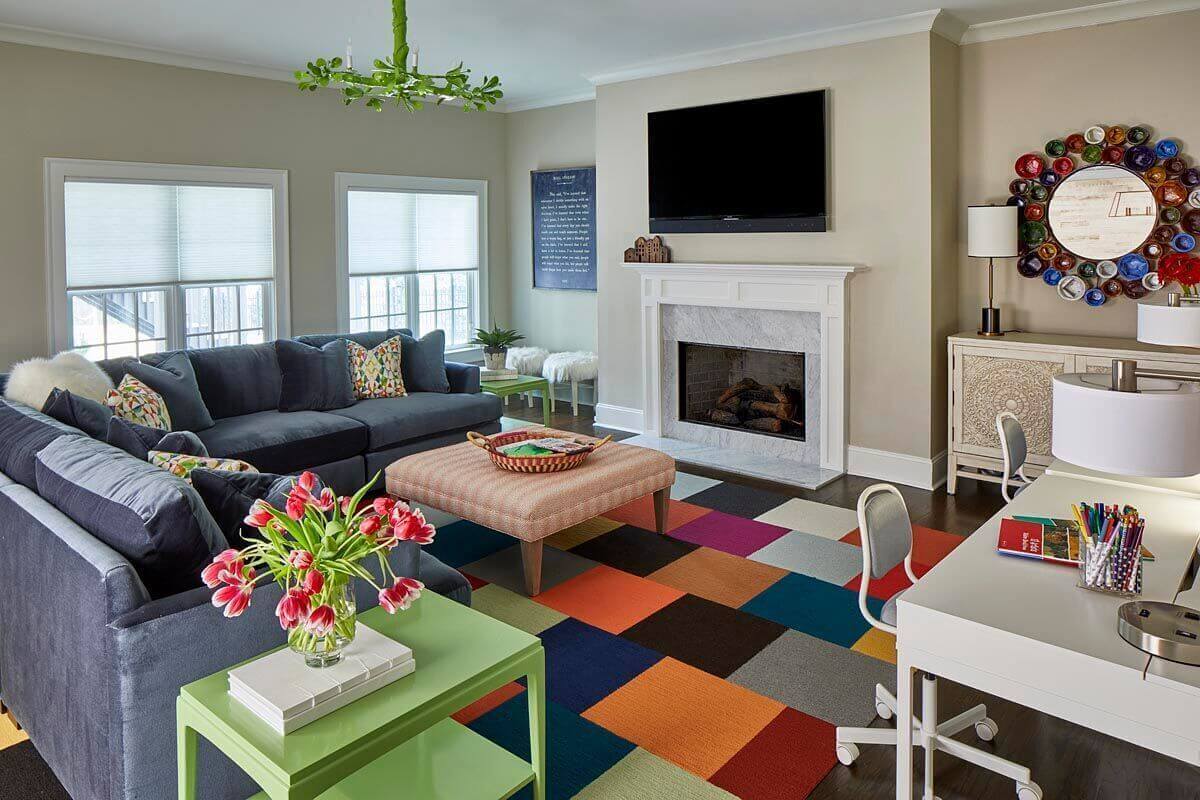 A colorful flor.com carpet (individual rug tiles) anchors the playroom, which is all about being fun and crafty.
