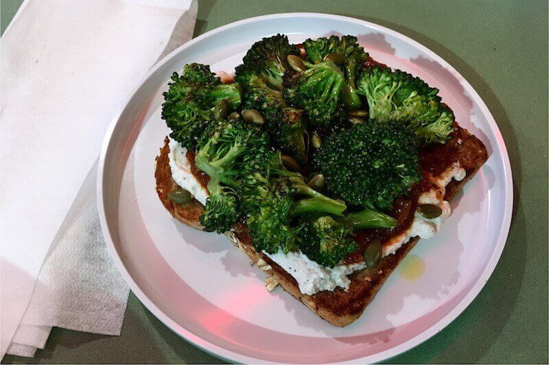 The broccoli toast is topped with charred broccoli, smoked ricotta and tomato jam. Trust us, it's bewilderingly good.