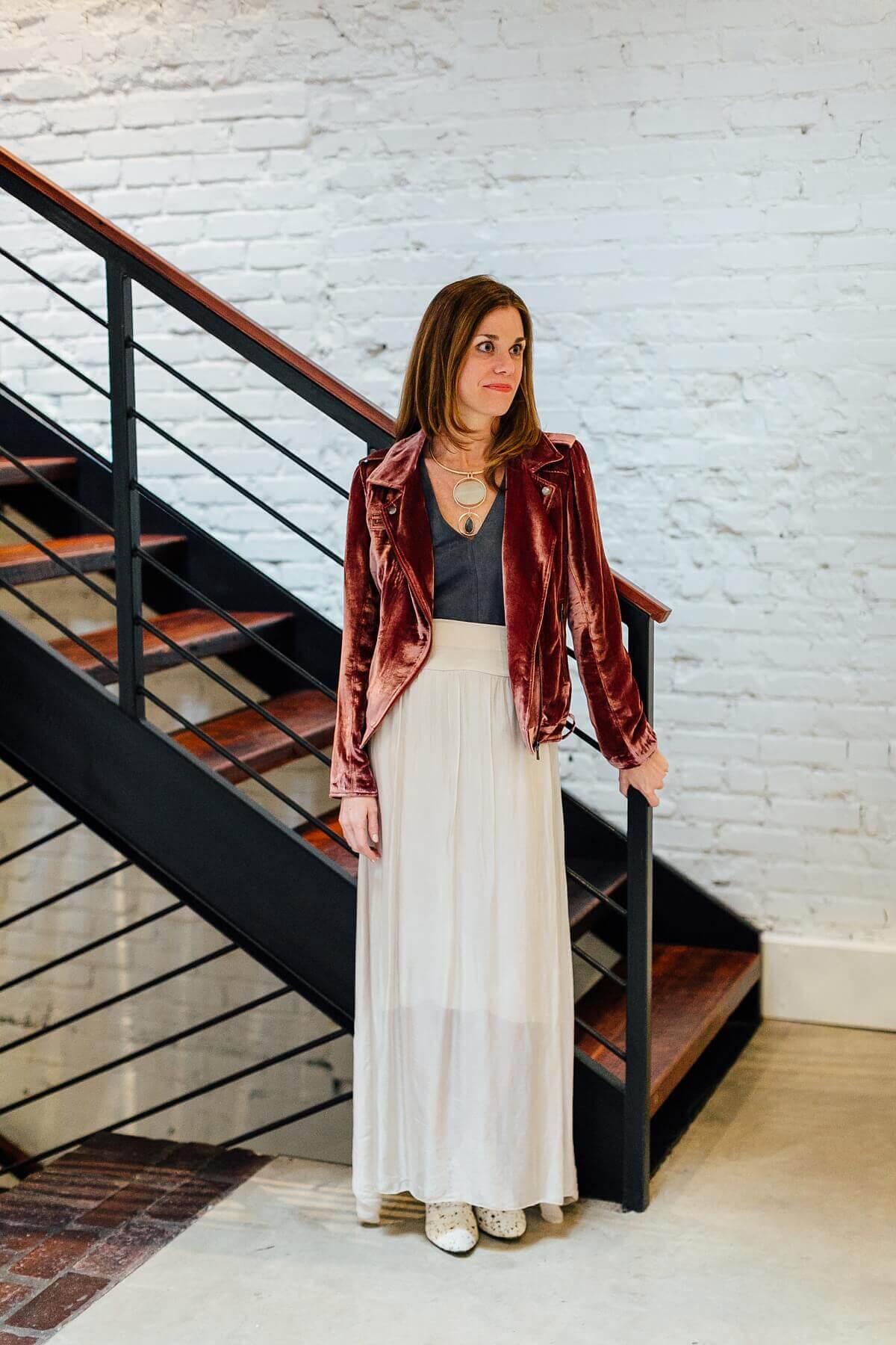 On Cameron: Velvet moto jacket from Lori James, $378; Suede v-neck from Lori James, $78; Long skirt from Lori James, $98; Necklace from Sachi, $60.