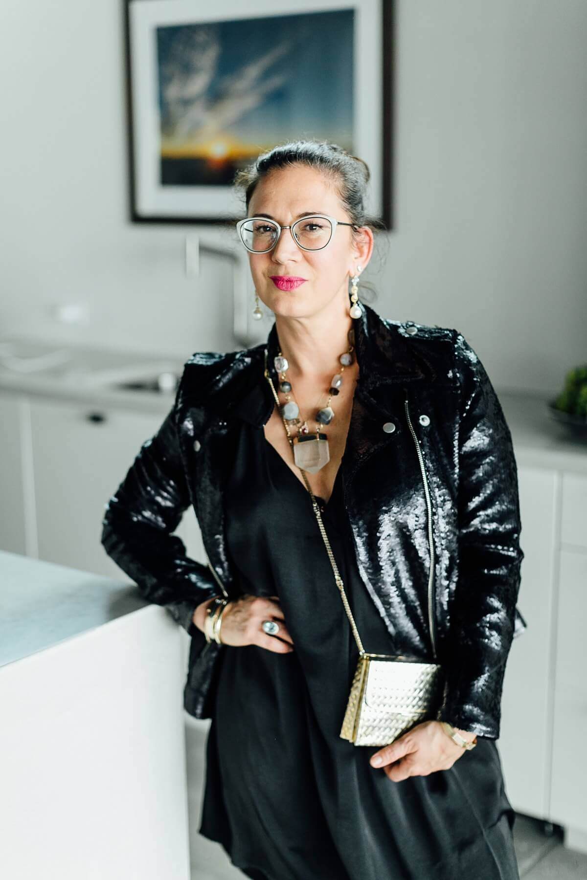 We love Augusta's local accessories! Her striking statement necklace is from Brave designs, and her yellow and white gold earrings with diamonds and pearls are from designer Mary Beth Harris. Not to mention that vintage Gucci purse... picture perfect!
