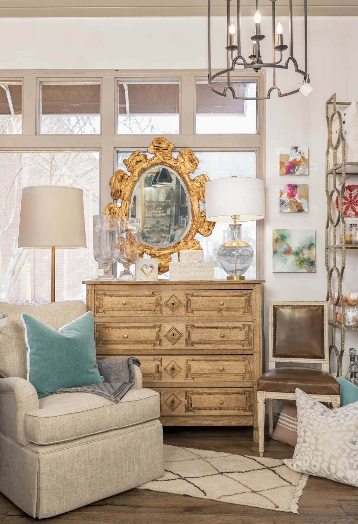 Antique dresser, fresh-looking chairs and a splash of color by way of a throw pillow make this an eye-pleasing vignette we'd love to have in our own home.