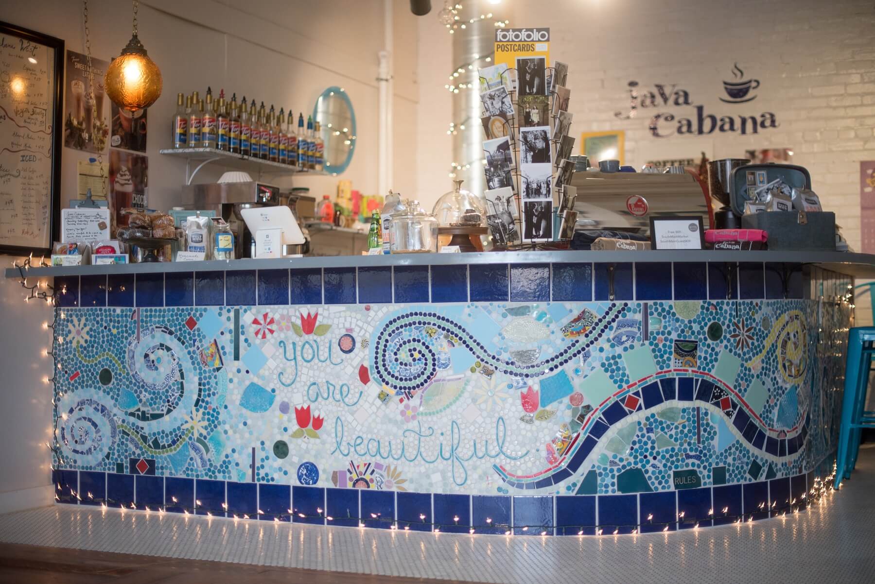 To bring a little of the charm of her original location downtown, Java Cabana owner Mary Burns collaborated with local artists Kristi Duckworth and Teresa White. “These amazing women breathed life into my ideas and helped me create a beautiful mural that wraps around the coffee counter.” Image: Creation Studios for The South Main Market