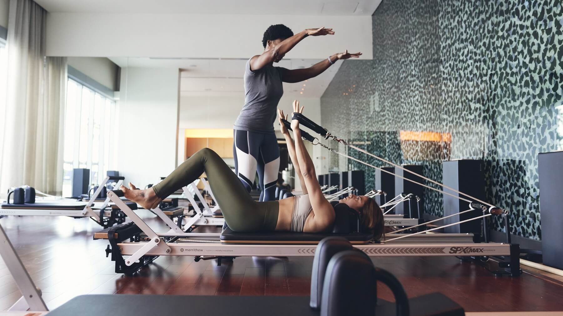 Two women doing fitness at a gym