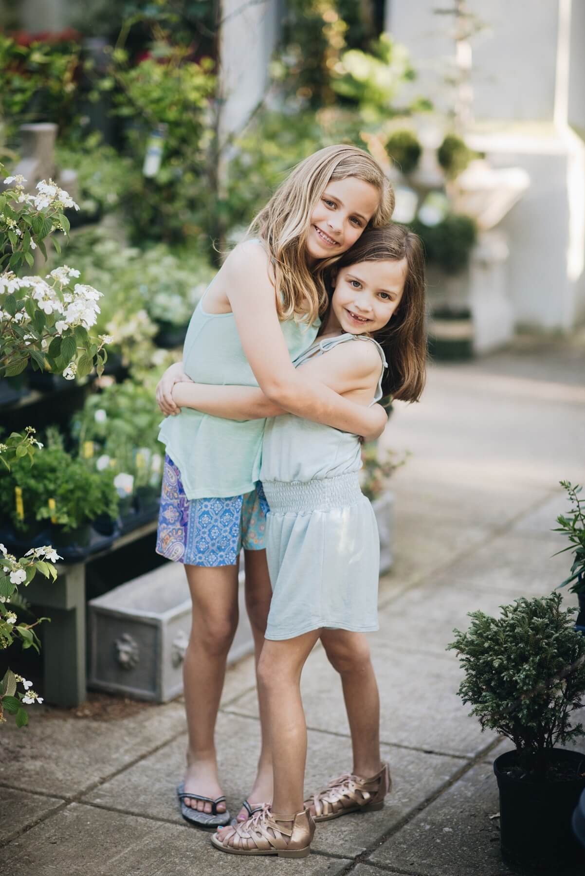 From <a href="https://styleblueprint.com/birmingham/guide/b-kids/" target="_blank" rel="noopener">b.kids</a>: Blue tank, $40; Printed shorts, $62; Romper, $40