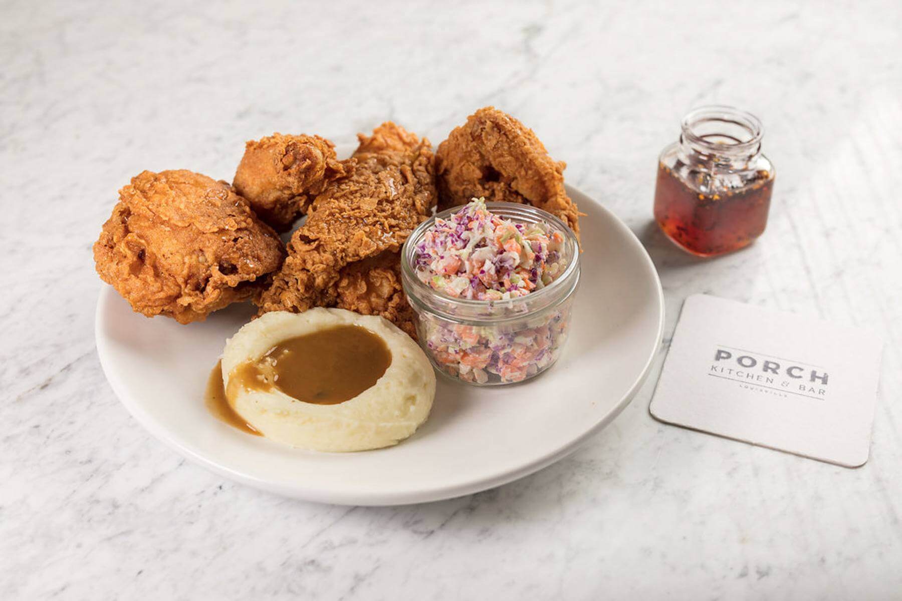 The menu wouldn’t be complete without Kentucky’s famous dish. The Southern Fried Chicken is made with Pilgrim's Pride organic chicken and a hot honey drizzle with a side of mashed potatoes & gravy and coleslaw. Now, that’s slap-yo-momma flavor! Porch