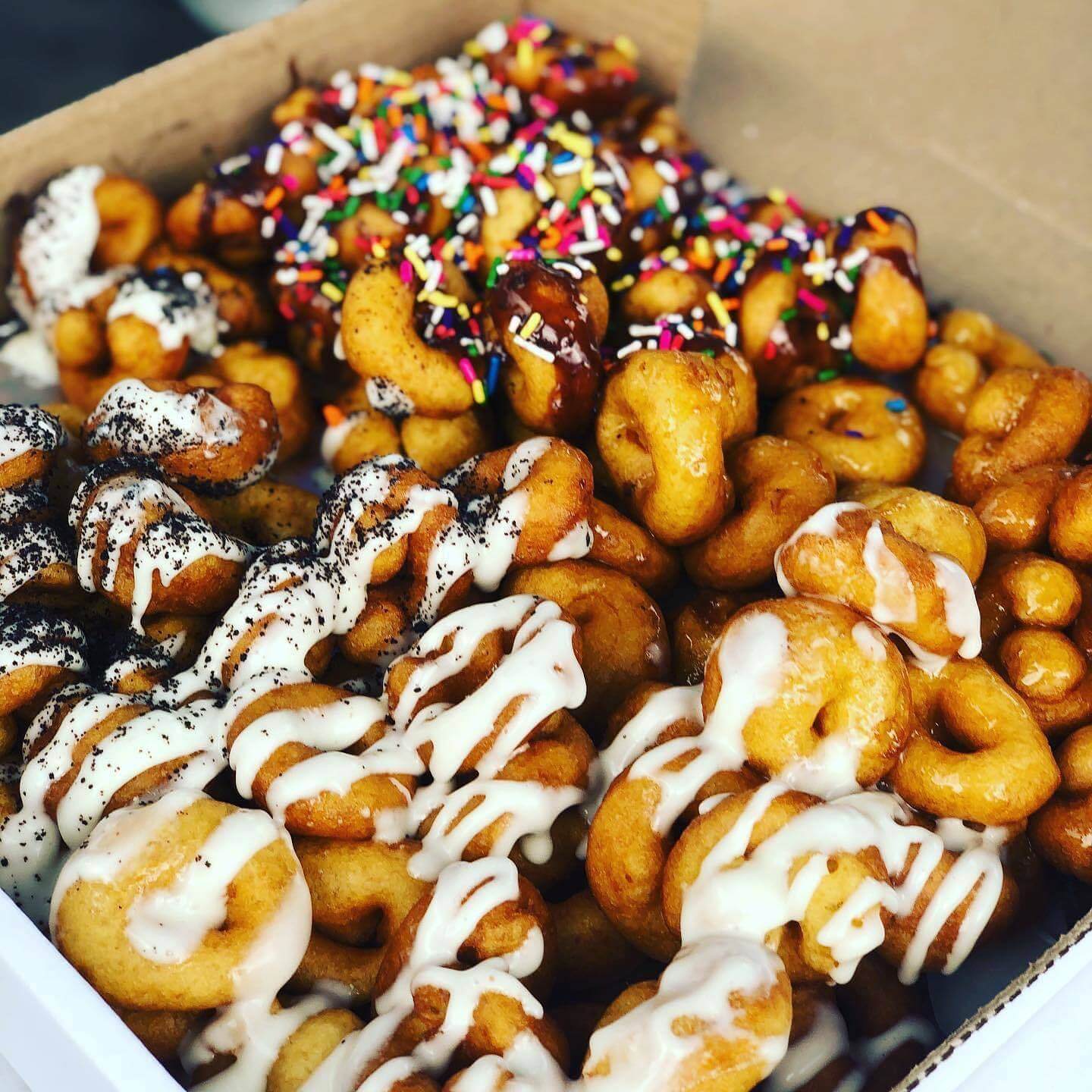 We'll take a flavor of each. Image: Happy Glaze Donuts Happy Glaze Donuts