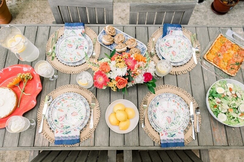We love how this tablescape combines bohemian accents with bright colors to establish a relaxed, yet stylish feel. The place settings and linens come from Bromberg's, the flowers come from Wild Things, the tomato tart, cobb salad and key lime pie come from Ashley Mac's and the cookie sandwiches come from Cookie Fix. We love how this tablescape combines bohemian accents with bright colors to establish a relaxed, yet stylish feel. The place settings and linens come from Bromberg's, the flowers come from Wild Things, the tomato tart, cobb salad and key lime pie come from Ashley Mac's and the cookie sandwiches come from Cookie Fix.