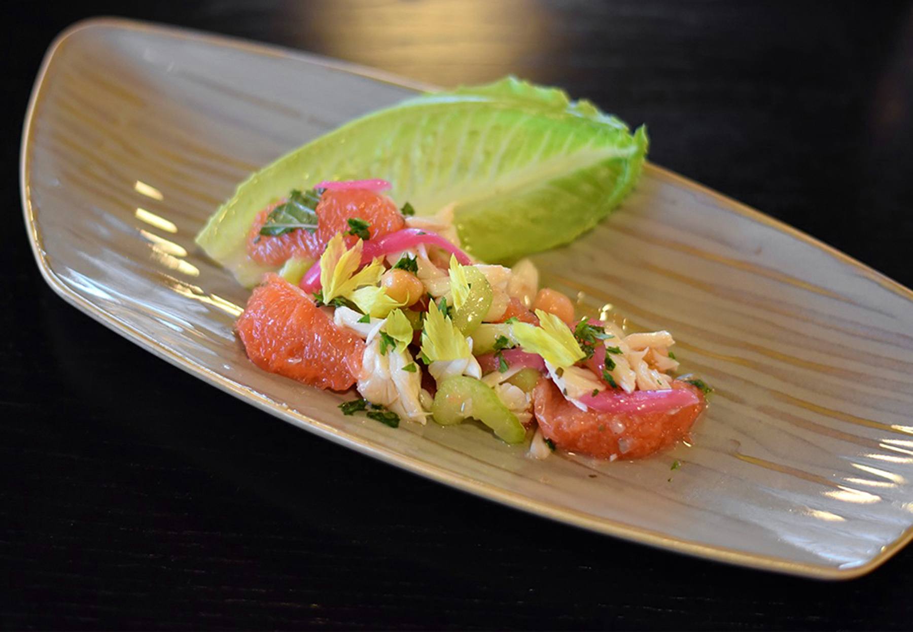 The West Indies Chickpea Salad is the perfect summer appetizer. It has celery, ruby red grapefruit and jumbo lump crabmeat. Blueprint on 3rd