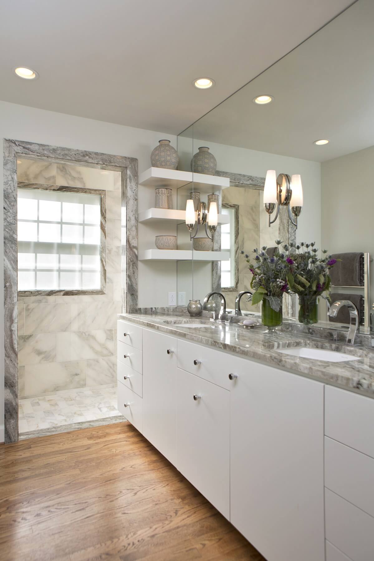 This bathroom features a "curbless shower." That is, a shower that requires no step to enter, thereby reducing any tripping hazard.