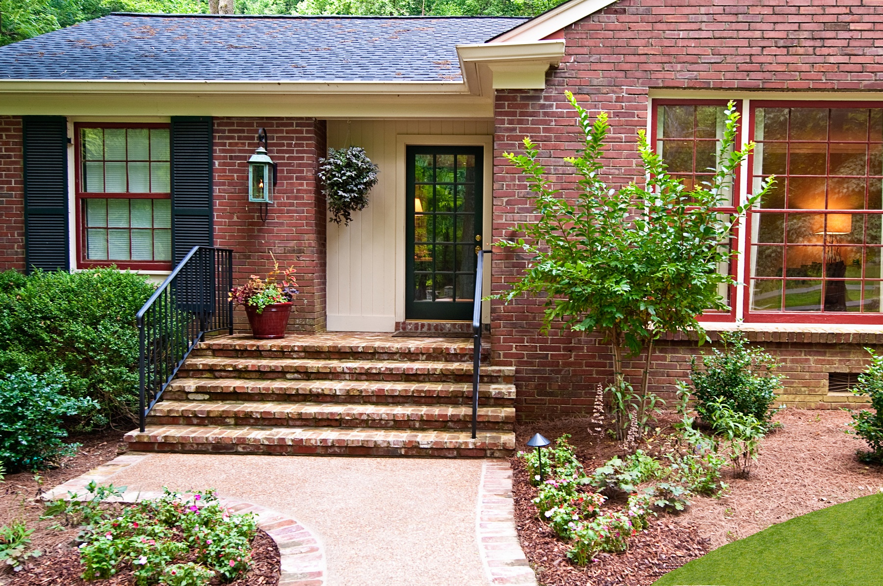 AFTER: The front steps have been widened and are more shallow making them not only easier to navigate, but roomy enough for someone to assist a loved one in climbing them.