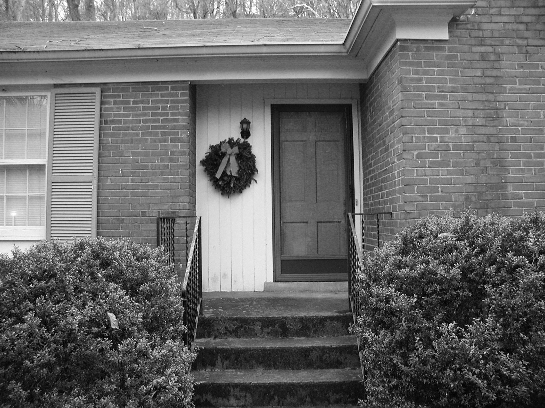 BEFORE: A narrow, set of average-size steps may seem easy to navigate, but as the homeowner ages, they may find the steps challenging, and there's not enough room for a person to assist.