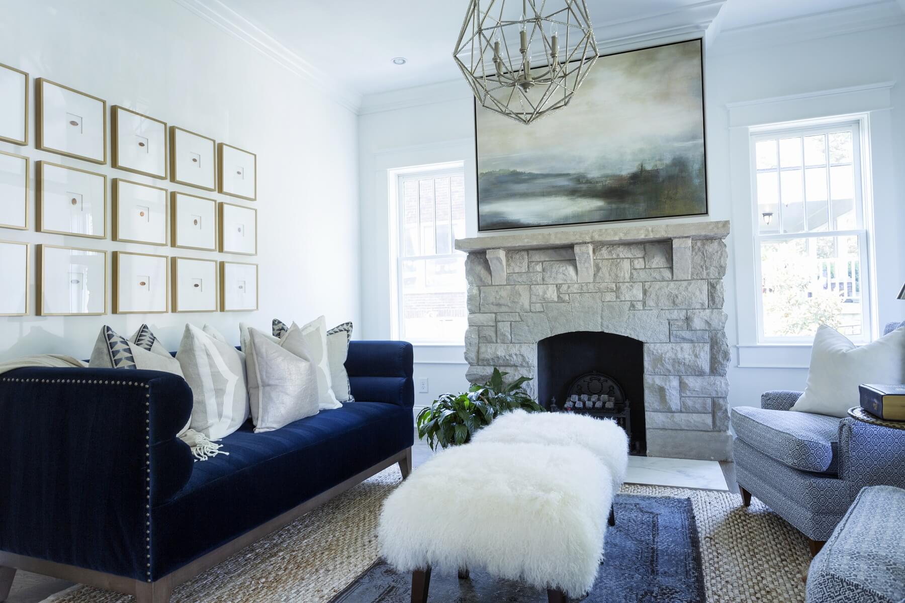 The stone fireplace creates a foundation for the beautiful art atop the mantel, a calming focal point in the space.