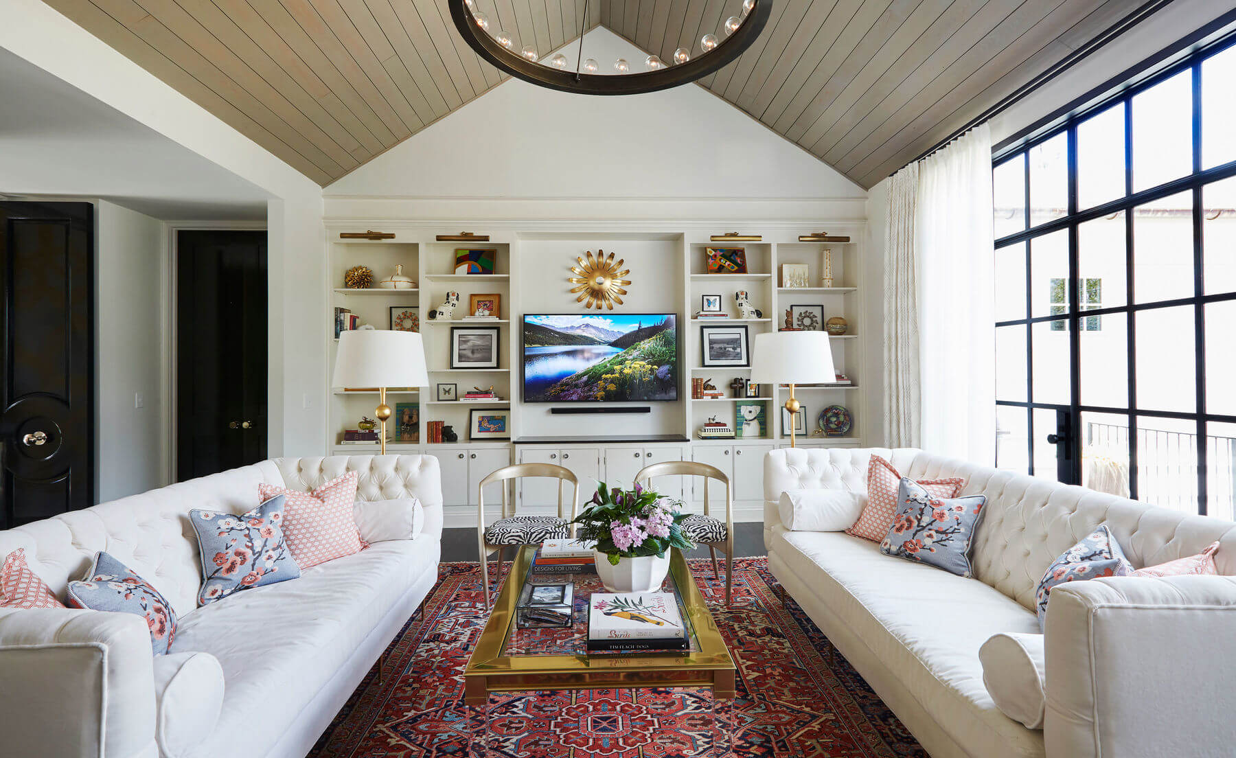 The other end of the living room offers plenty of built-in storage and shelving.