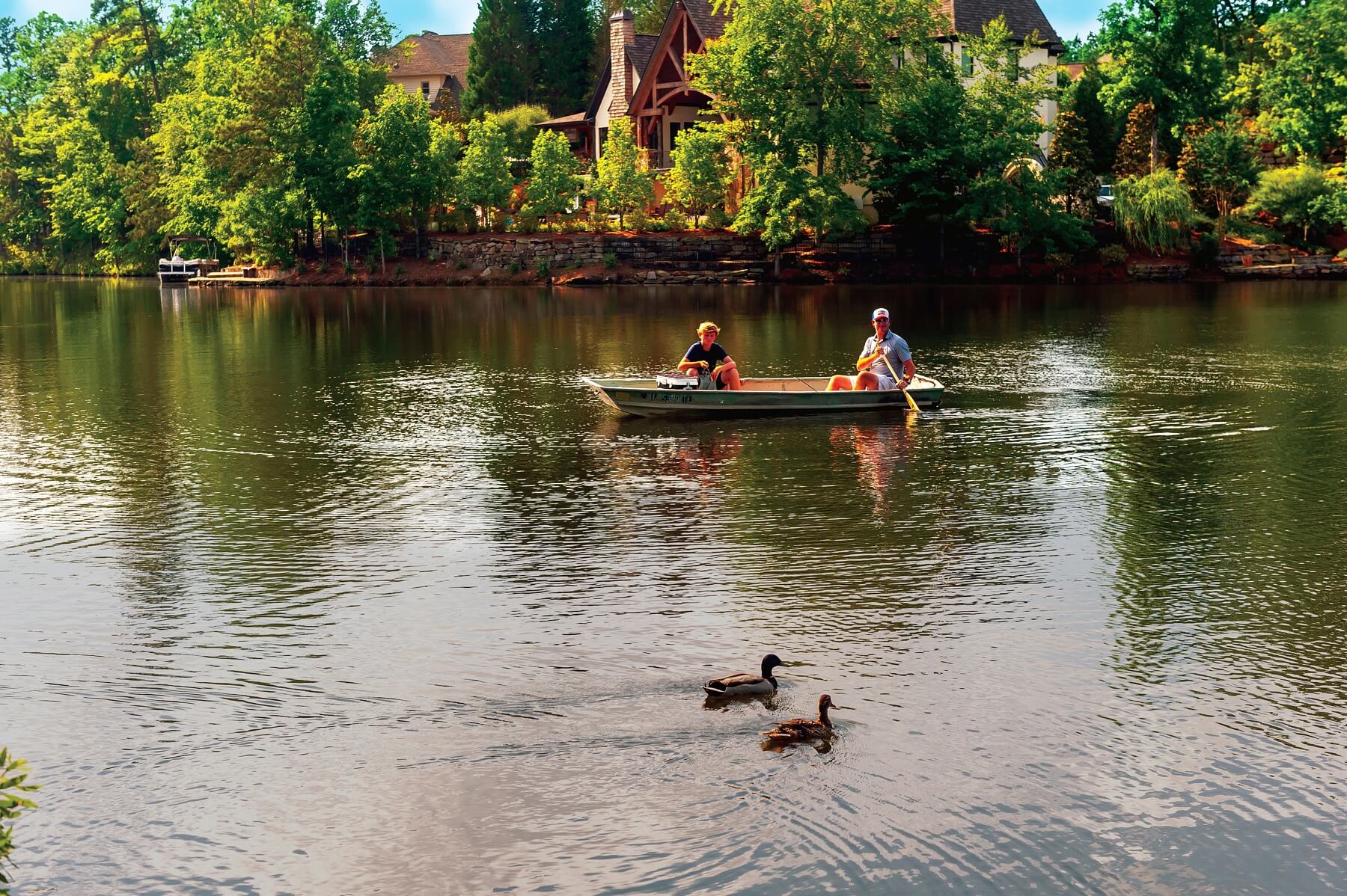 A father and son enjoy some time on a lake at Liberty Park. Liberty Park