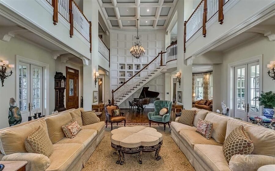 There are so many architectural details to note in this room. From the coffered ceilings to the French doors, everything detail delights.