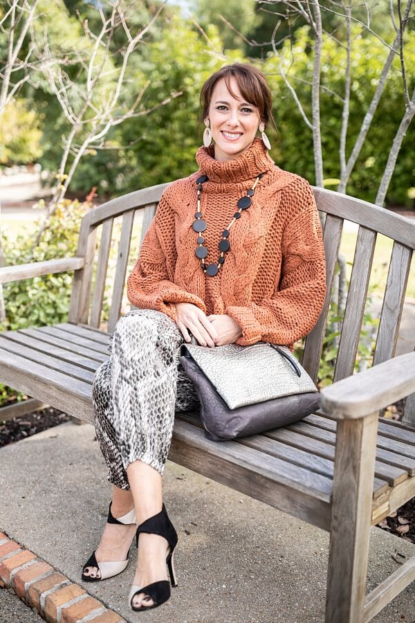 Gina is comfy and casual in her chunky sweater and fun pants. 