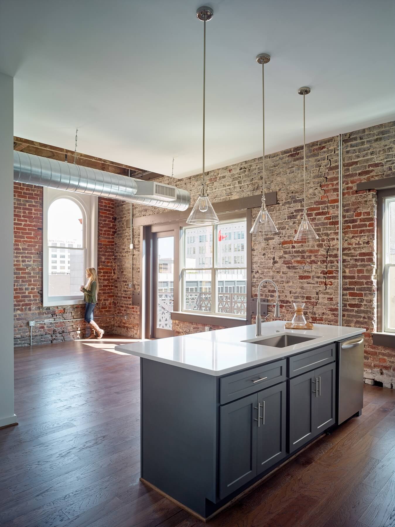 Arched windows and balconies with views of the Magic City make this a space we'd love to call home. Image: Luker Photography