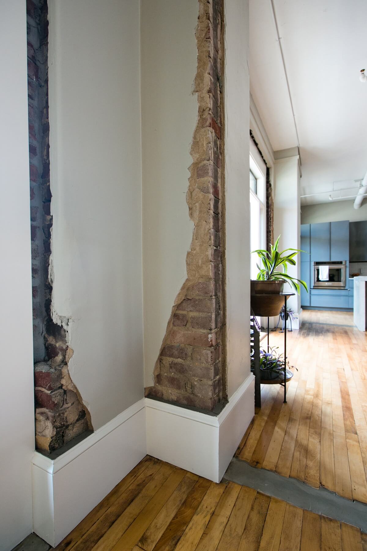 Exposed brick peeks forth in interesting formations, almost like a work of modern art. Image: Creature