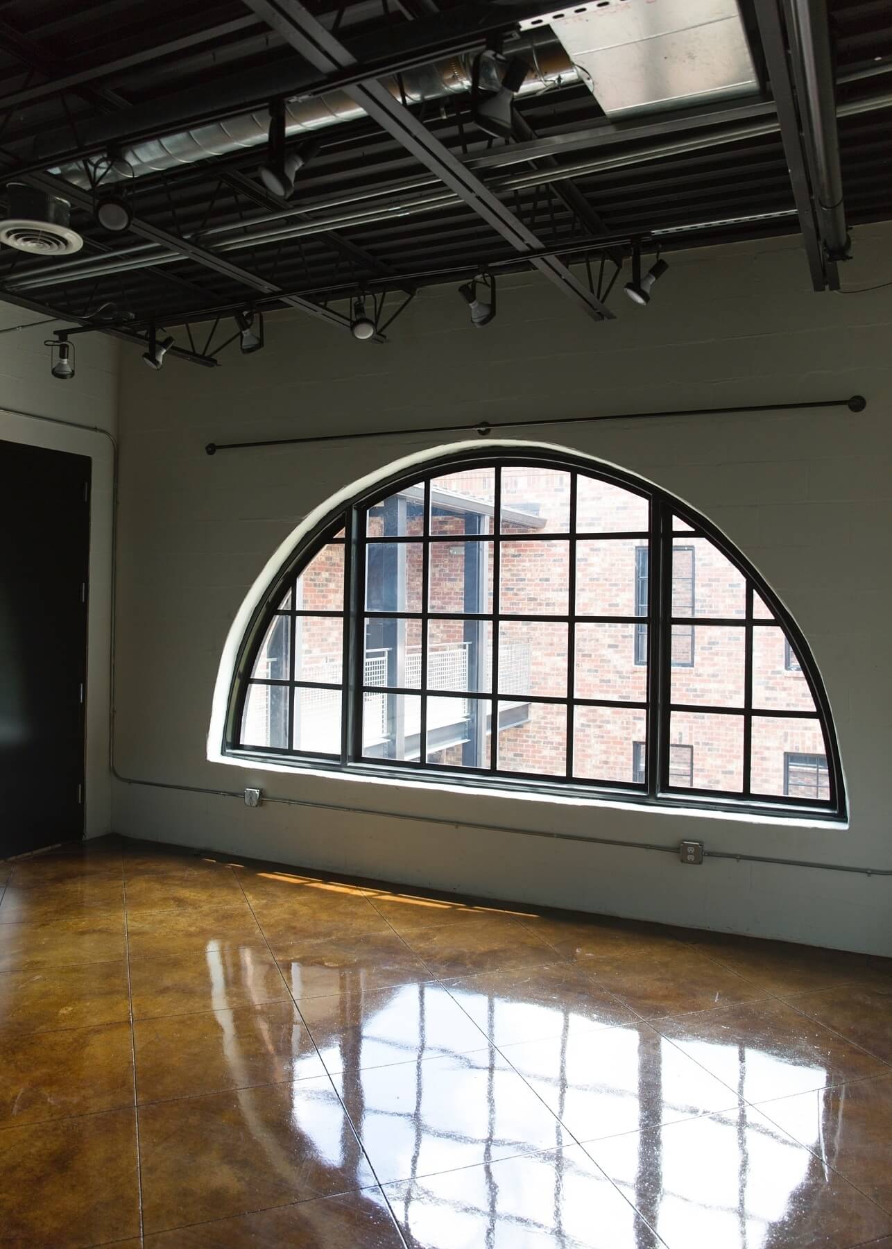We love how the light interplays with the gleaming stained concrete floors. Image: Luker Photography 