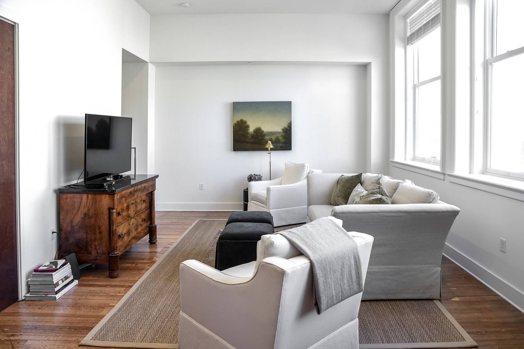 Elegant textures in the more modern sitting area meet gorgeous antique furniture for a collected look. Image: Mindy Rohr