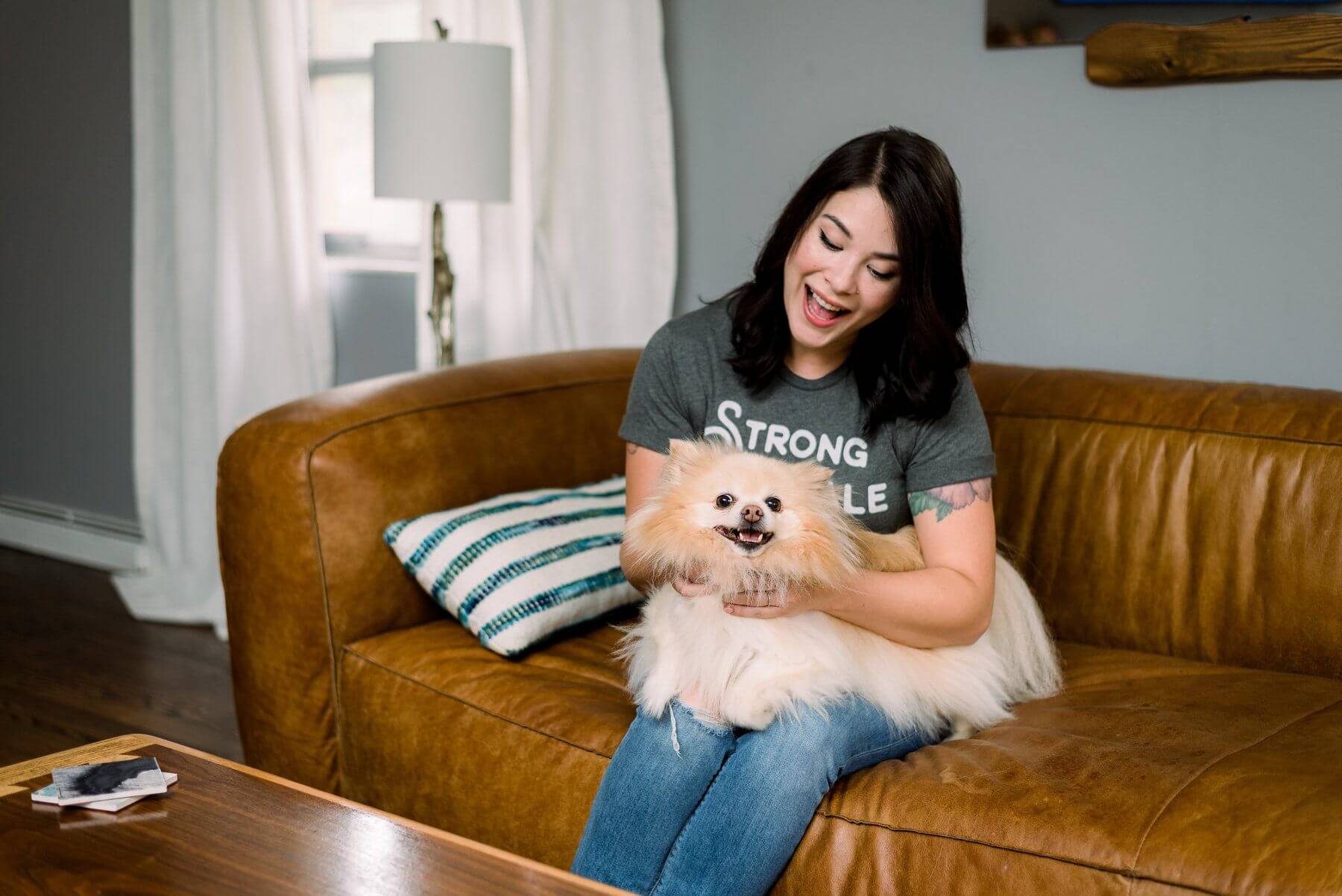 Talia goofs off with her dog. 