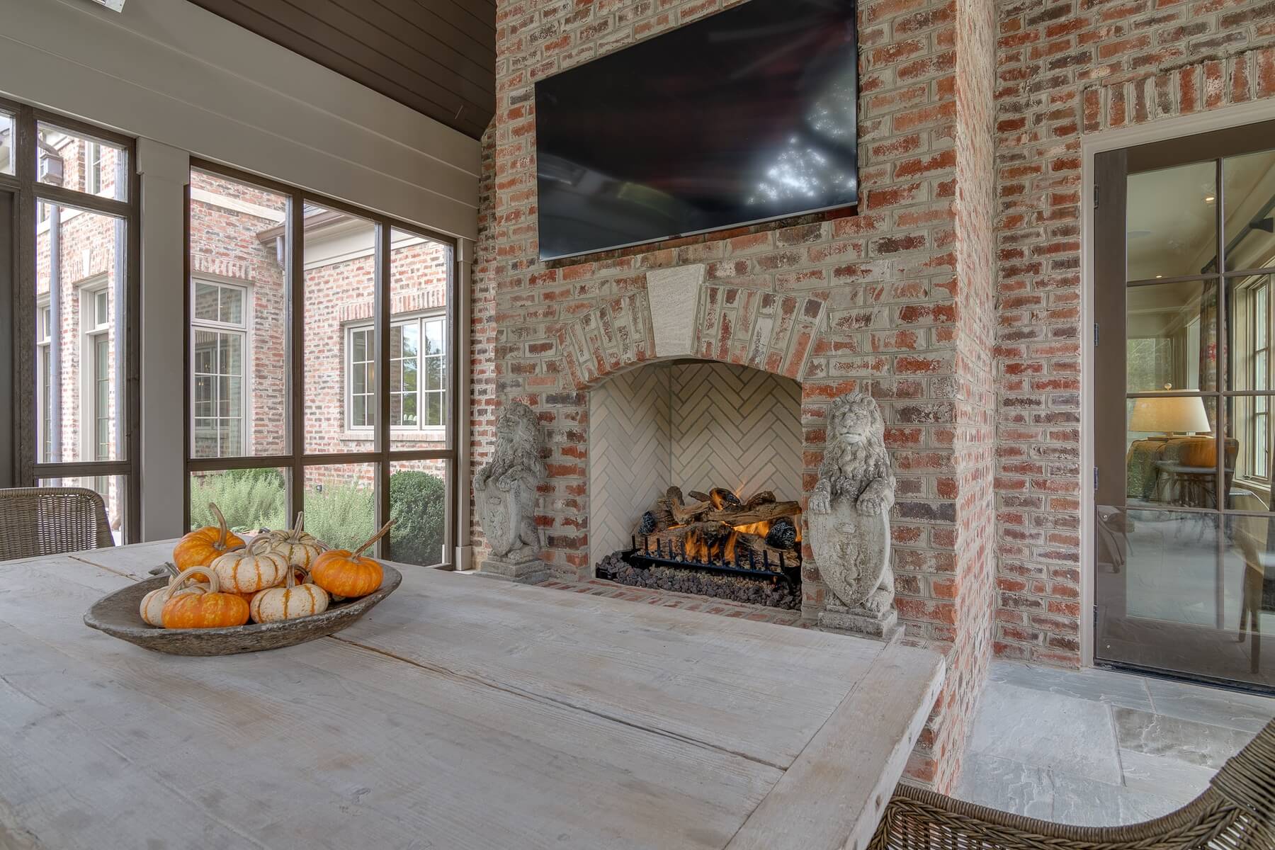 This versatile outdoor space features a large fireplace and infrared heating, making it a true extension of the home’s living space that can be enjoyed at all times of the year.