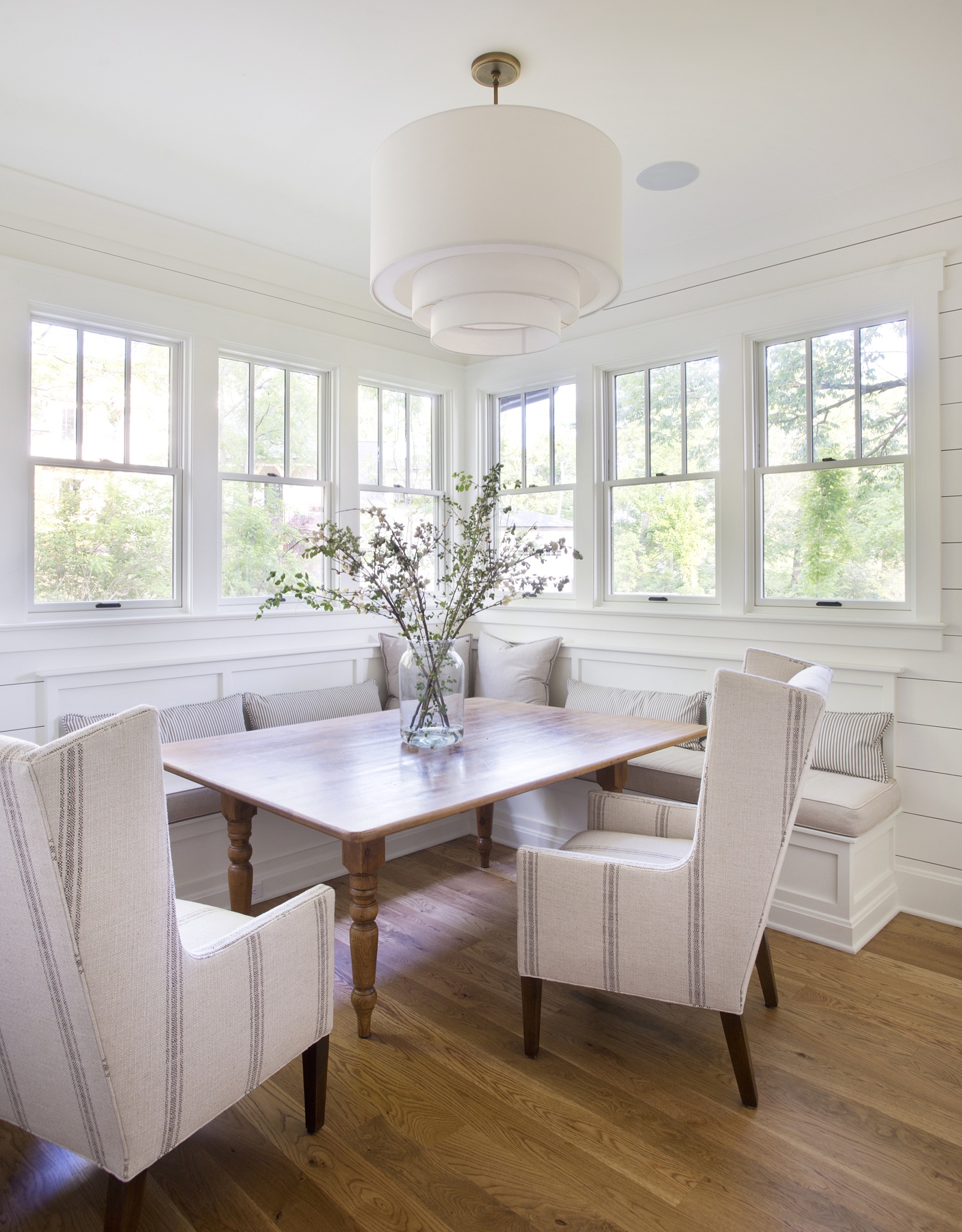 The beautiful eat-in breakfast nook offers plenty of natural light and a bright and airy feel.