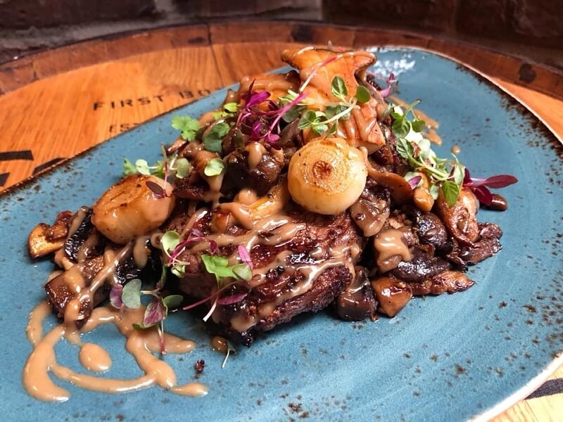 Steak and onion entree at Louisville restaurant, Le Moo