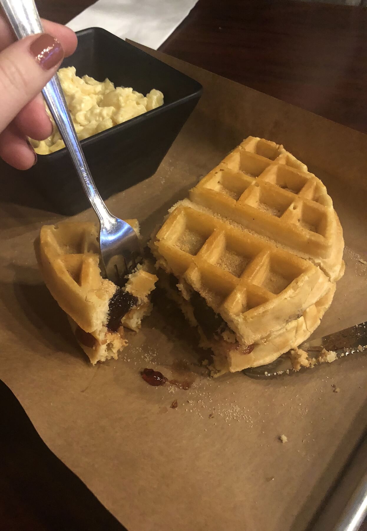 The pressed PB&J melts peanut butter and jelly between warm waffles, served here with a side of creamy mac 'n' cheese — yum! The pressed PB&J melts peanut butter and jelly between warm waffles, served here with a side of creamy mac 'n' cheese — yum!