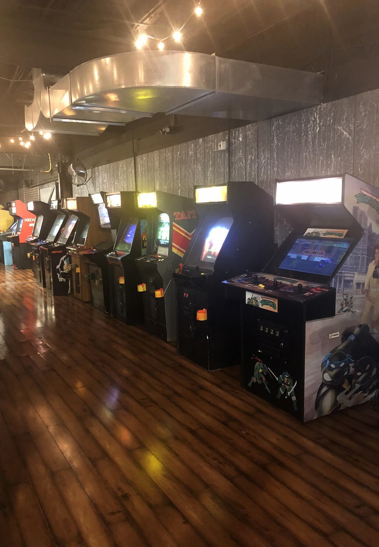 Vintage and new arcade games line the walls of the sprawling eatery and arcade. Vintage and new arcade games line the walls of the sprawling eatery and arcade.