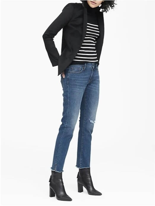 A distressed jean, stripes and power boot take this otherwise plain look to the next level. Image: Banana Republic