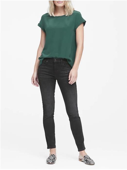 The half-tuck of this emerald silk blouse plus the snakeskin mules are simple but powerful focal points. Image: Banana Republic