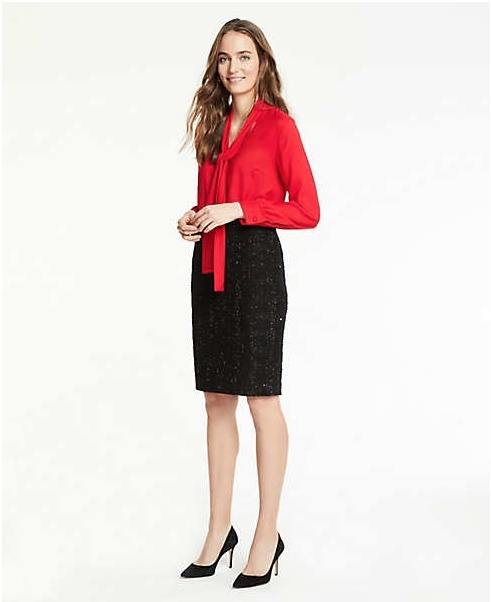 This tweed pencil skirt has a hint of sparkle that catches the eye, and the ties on this red silk shirt provide an elongating focal point. Image: Ann Taylor