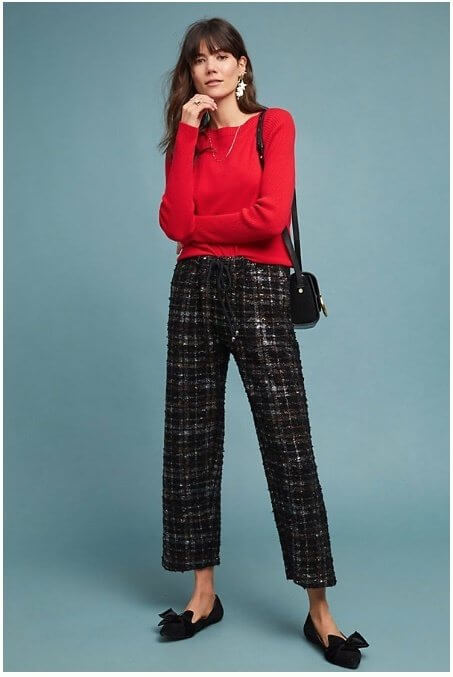 Statement earrings, metallic plaid pants and bow-adorned flats are three fabulous focal points here. Image: Anthropologie