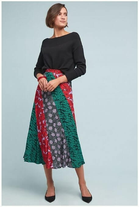 A black top and black flats keep this patchwork skirt from running the show. Image: Anthropologie