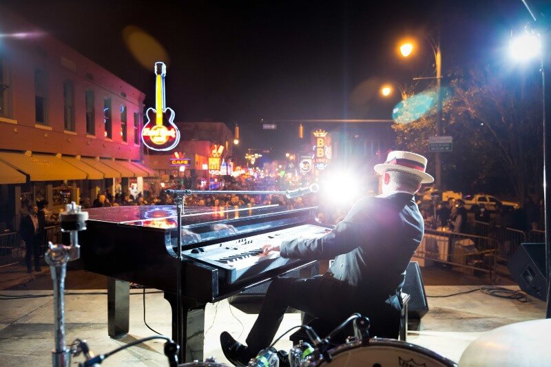 What are you doing New Year's Eve? We've got ideas! Image: Beale Street New Year's Eve in Memphis- piano player on stage