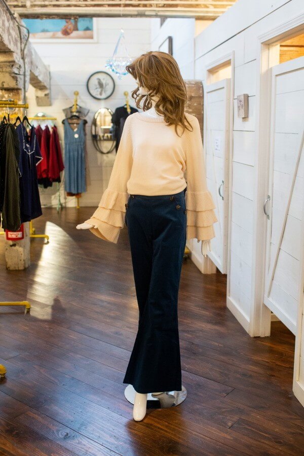 From Work the Metal: Peach tiered bell sleeve sweater, $79; corduroy pants, $54 what to wear louisville february